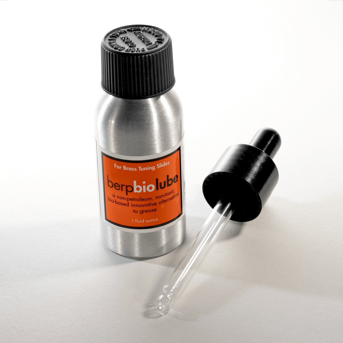 Metallic bottle with dropper labeled 'berpbiolube' on a white background