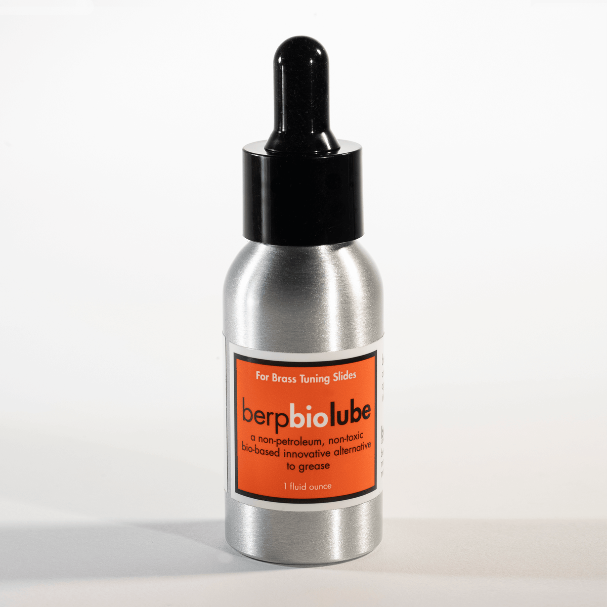 Metallic bottle with dropper labeled 'berpbiolube' on a white background