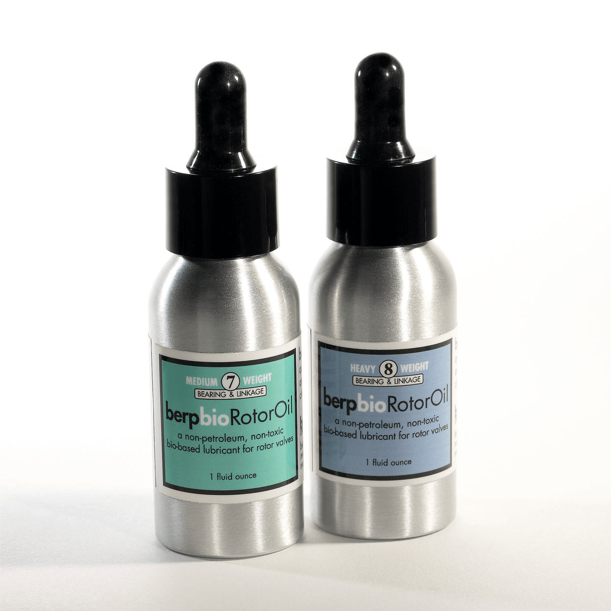 Two metallic bottles with dropper caps labeled 'berp bio Rotor Oil' on a white background.
