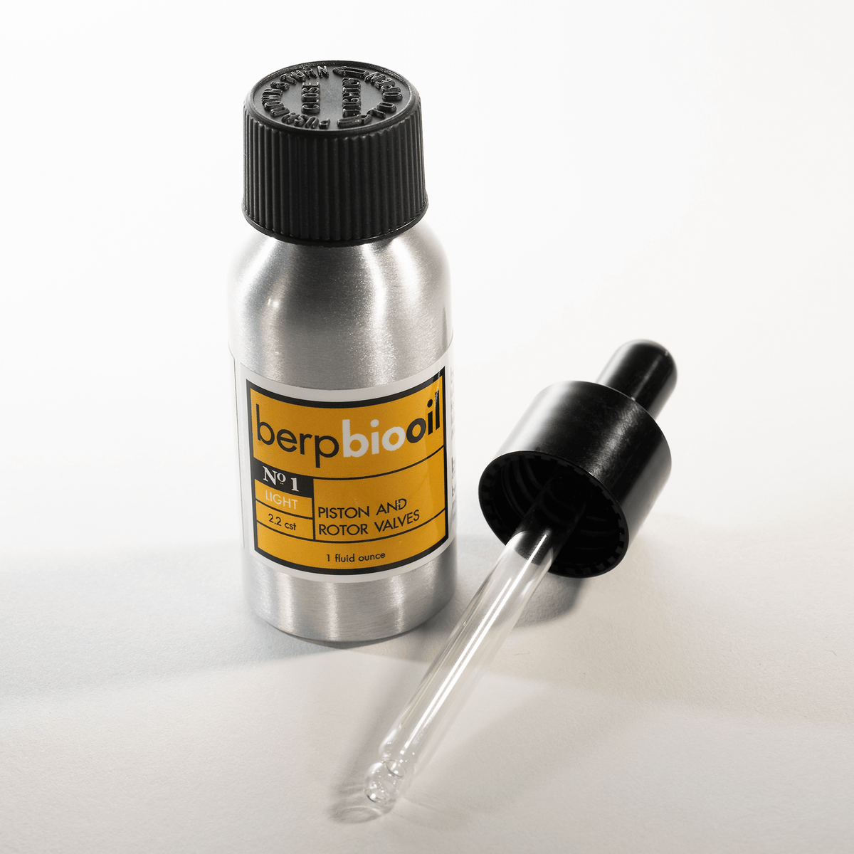 Metal bottle with dropper labeled 'berp biooil' on a white background